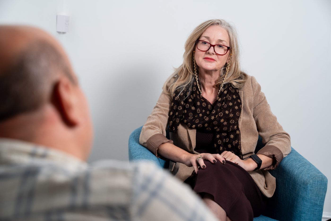 A counsellor listening to a client in the Wrexham counselling room